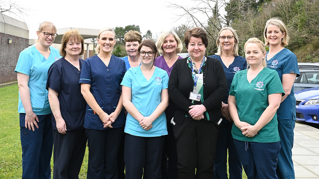 A group of nurses outside Cavan Hospital smiling at the camera